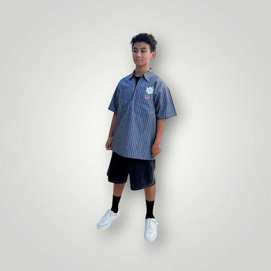 KA'EO Apparel grey pinstripe short-sleeve butcher shirt with quarter-zip and floral embroidery.