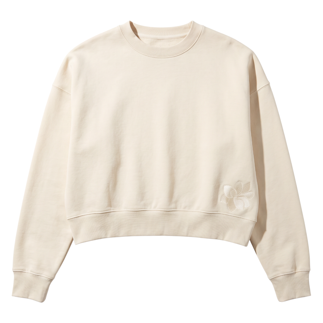 KA'EO Apparel cream relaxed cropped crewneck fleece sweatshirt with subtle floral embroidery on the hem