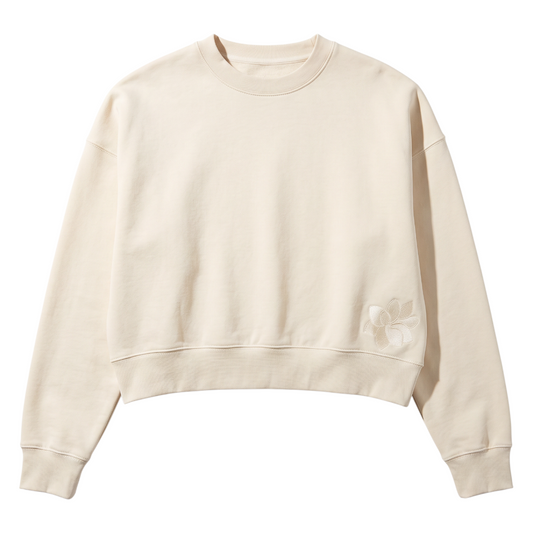 KA'EO Apparel cream relaxed cropped crewneck fleece sweatshirt with subtle floral embroidery on the hem