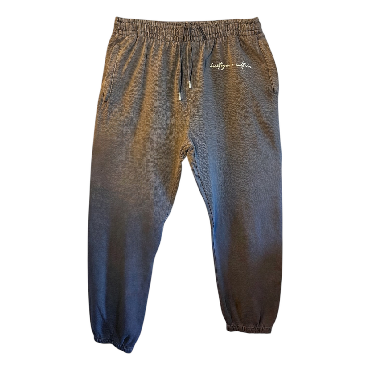 KA'EO Apparel charcoal heavyweight cotton joggers with elastic waistband, drawstring, and embroidered logo detail.
