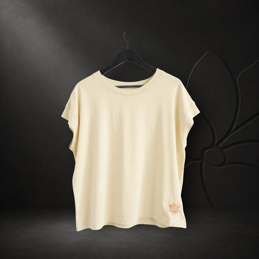 KA'EO Apparel vintage wash natural cotton t-shirt with short sleeves and small floral embroidery detail on the hem.