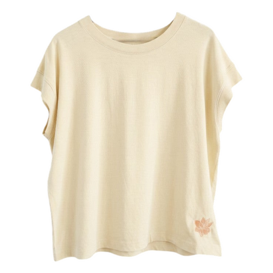KA'EO Apparel vintage wash natural cotton t-shirt with short sleeves and small floral embroidery detail on the hem.