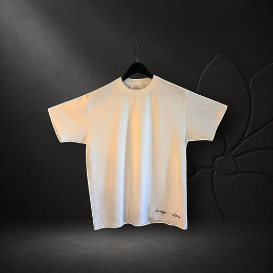 KA'EO Apparel white oversized heavyweight cotton t-shirt with black embroidered heritage + culture text on the hem.