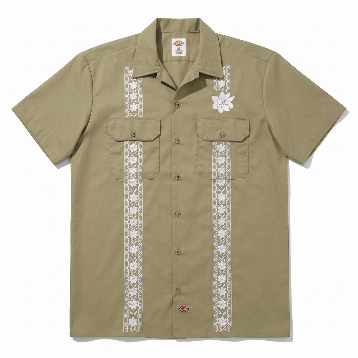 KA'EO Apparel x Dickies olive green short-sleeve guayabera shirt with white floral embroidery and dual chest pockets.
