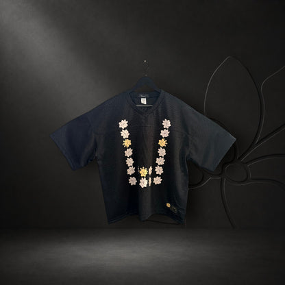 KA'EO Apparel black mesh cropped football jersey featuring a Sampaguita flower graphic in a Barong-style U-shape.