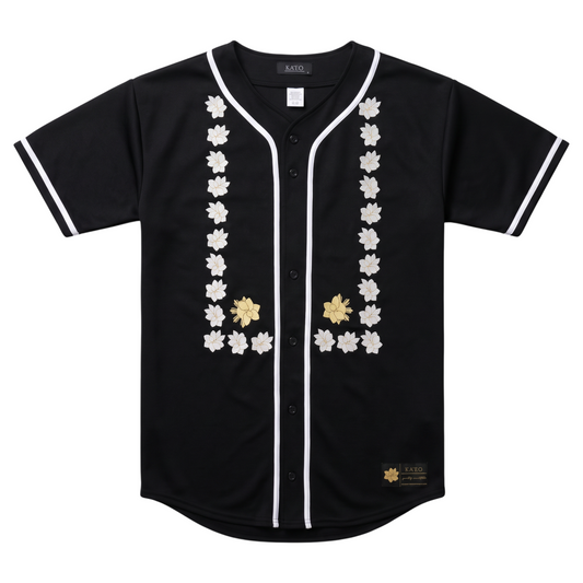 KA'EO Apparel black baseball jersey with white piping and intricate Sampaguita floral print on the front.