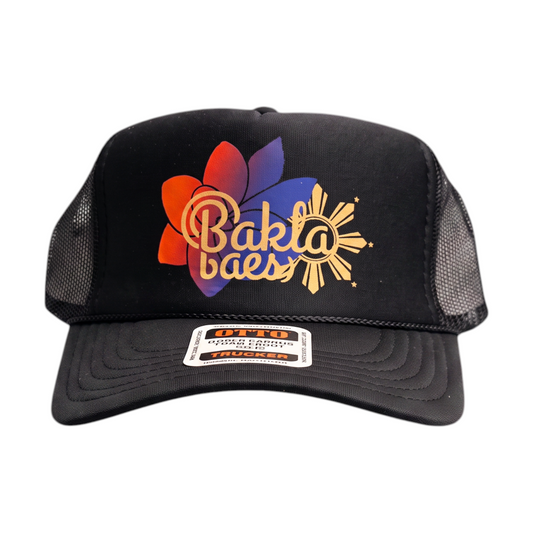 KA'EO Apparel black trucker hat with BaklaBaes and KA'EO sampaguita and Filipino sun graphic on a foam front panel