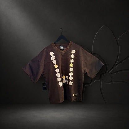 KA'EO Apparel brown mesh cropped football jersey with a U-shaped Sampaguita floral print on the front.