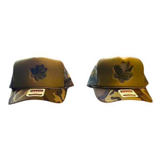 KA'EO Apparel Camo Sampaguita foam trucker hats with embroidered floral motif and breathable mesh back panels.