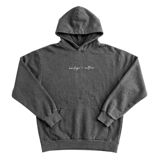 KA'EO Apparel charcoal vintage wash hoodie with heritage + culture embroidery on the chest and a kangaroo pocket.
