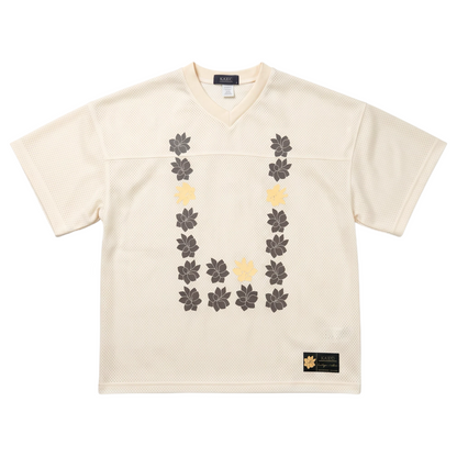 KA'EO Apparel cream mesh cropped football jersey with brown and yellow Sampaguita flower graphic in a U-shape design.