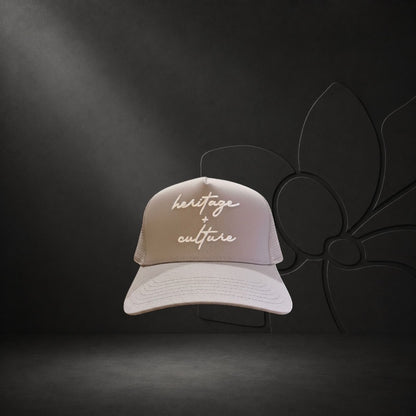 KA'EO Apparel gray cotton snapback cap with embroidered 'heritage + culture' text and curved brim.