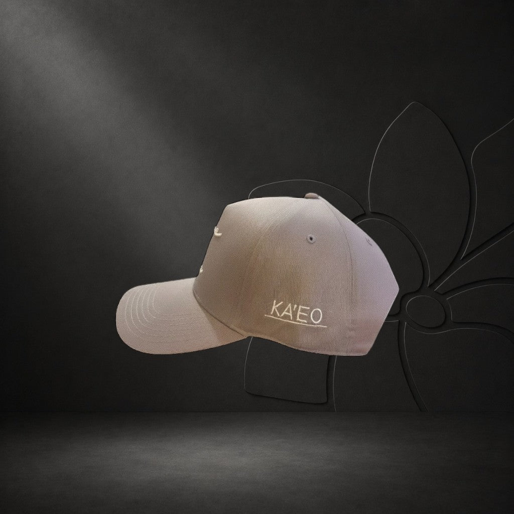 KA'EO Apparel gray cotton snapback cap with embroidered 'heritage + culture' script and side branding.