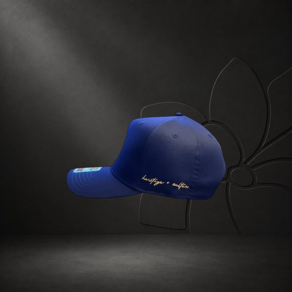 KA'EO Apparel Navy Embroidered Sampa-Sol Snapback with gold "heritage + culture" script on side.