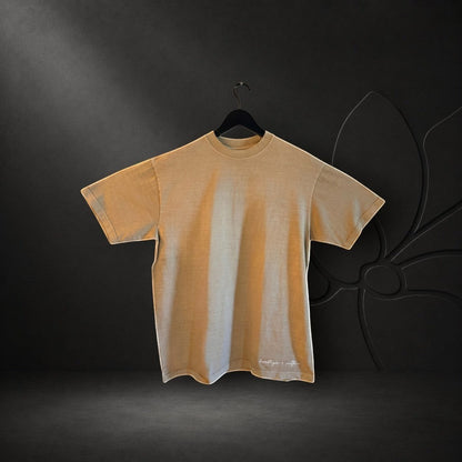 KA'EO Apparel vintage bone oversized heavyweight t-shirt with white Heritage + Culture embroidery on the hem.